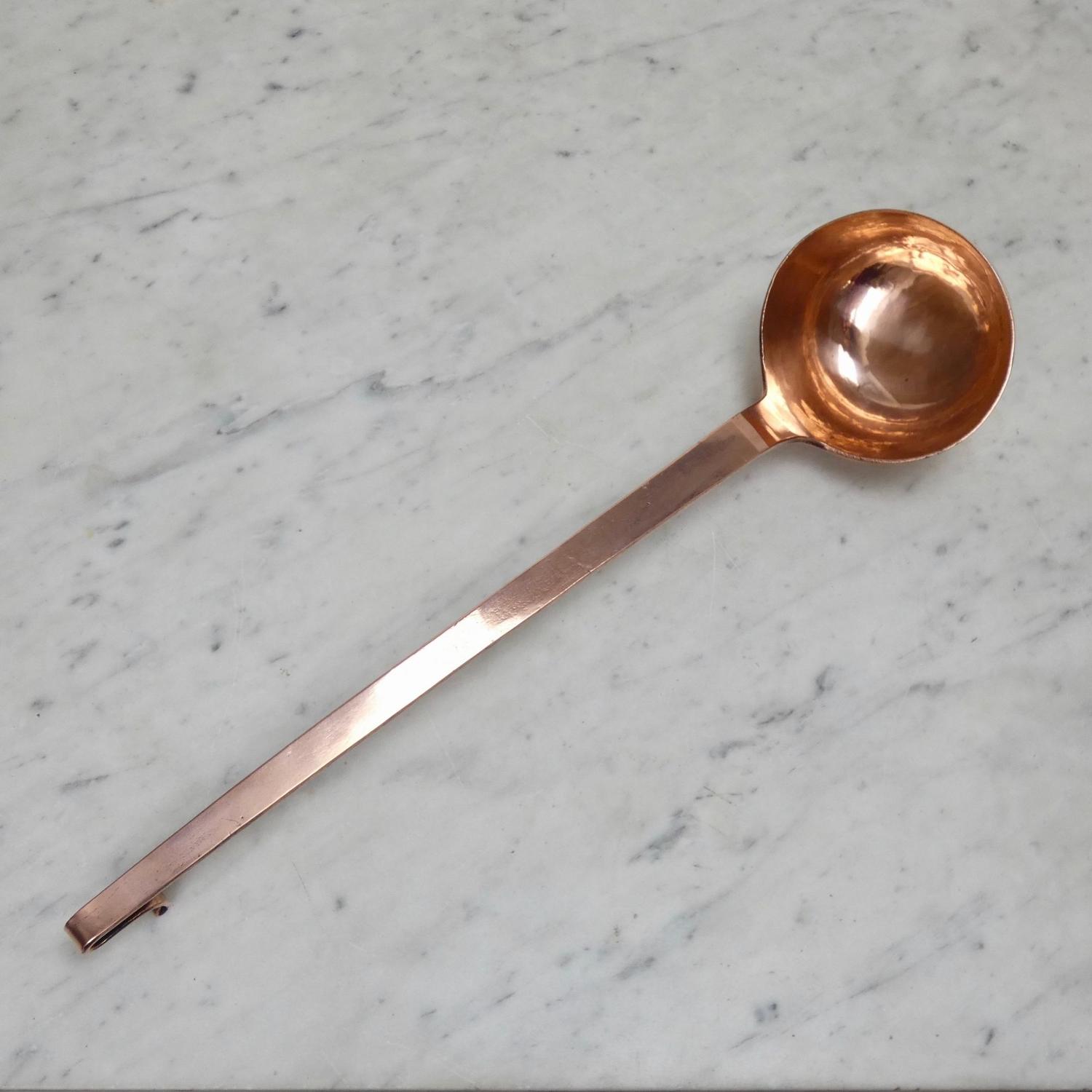 Large, antique, copper ladle