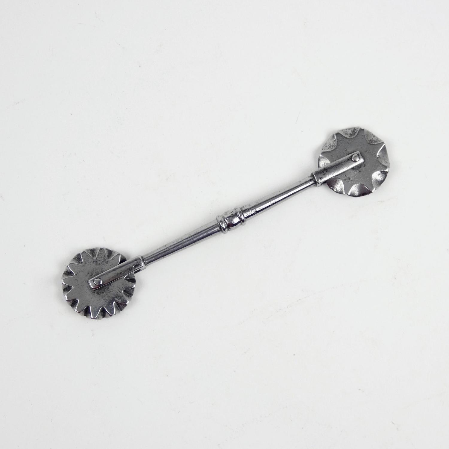 Early, steel pastry tool
