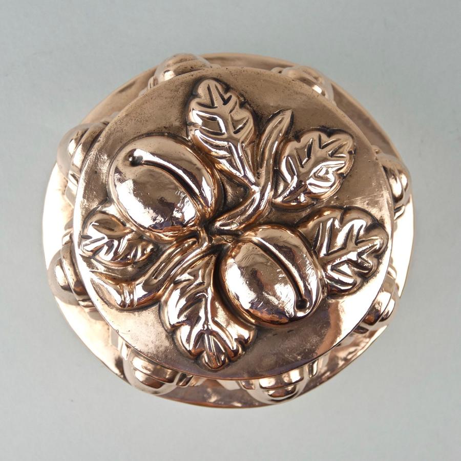 Copper mould with plums.