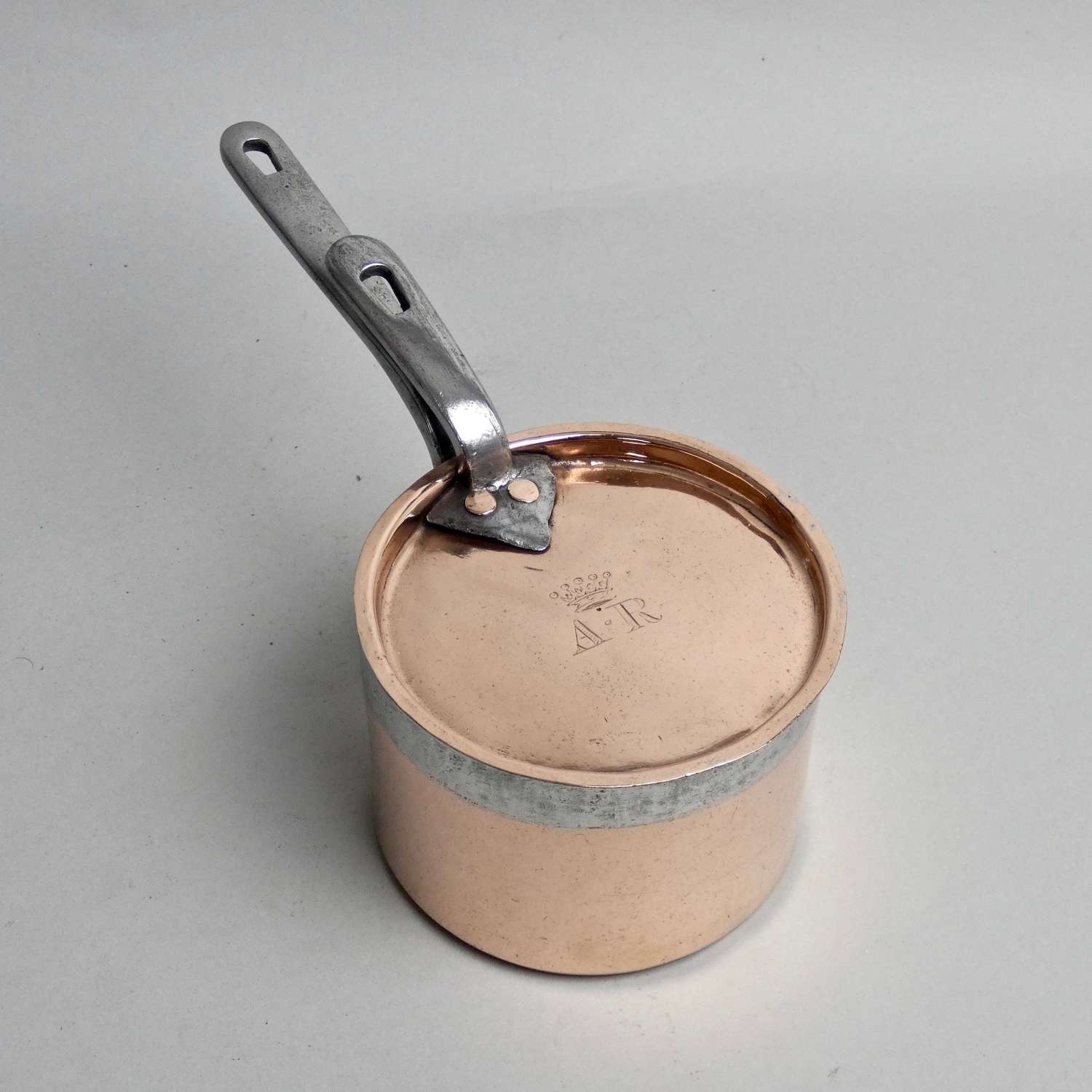 Small, engraved copper saucepan