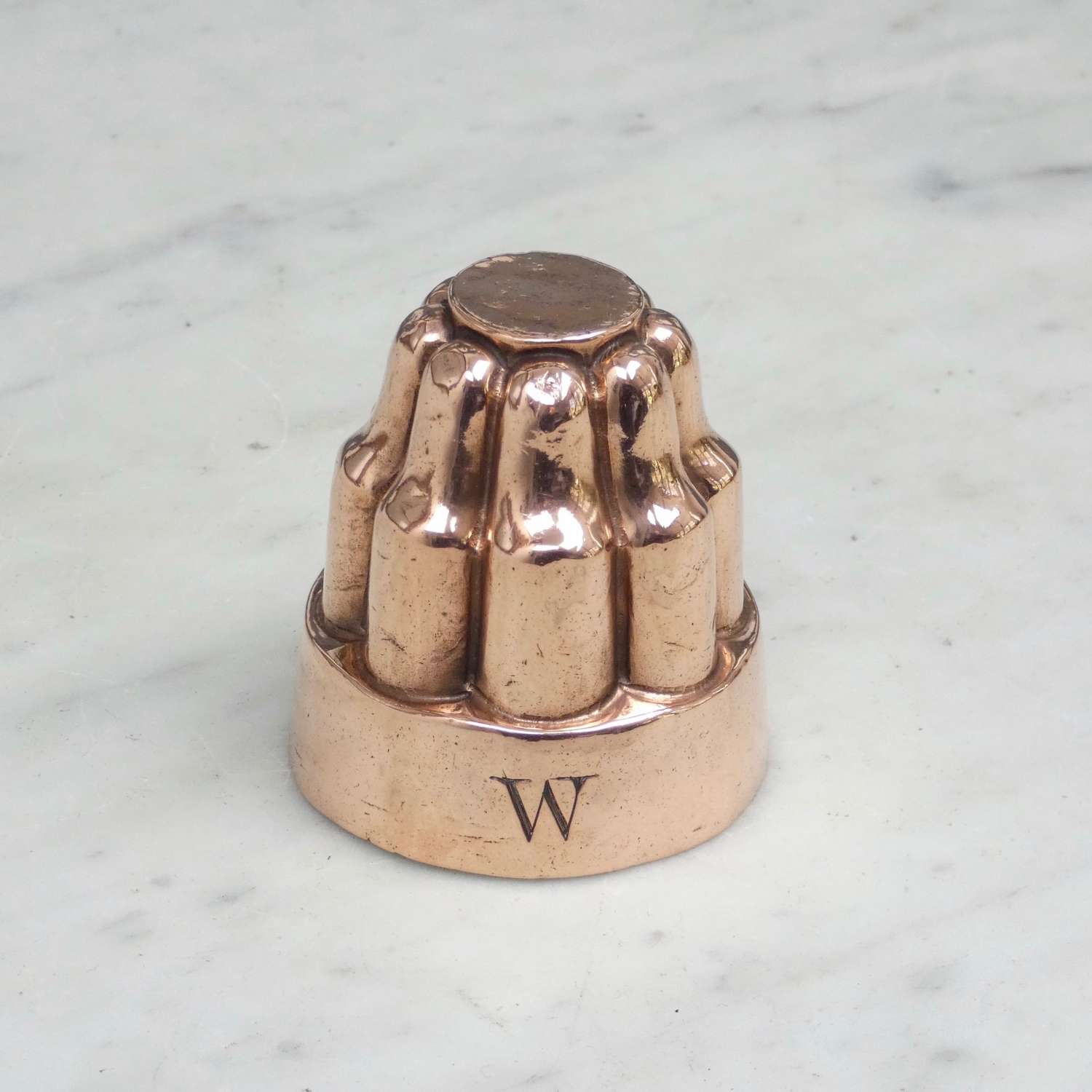 Copper mould with engraved 'W'