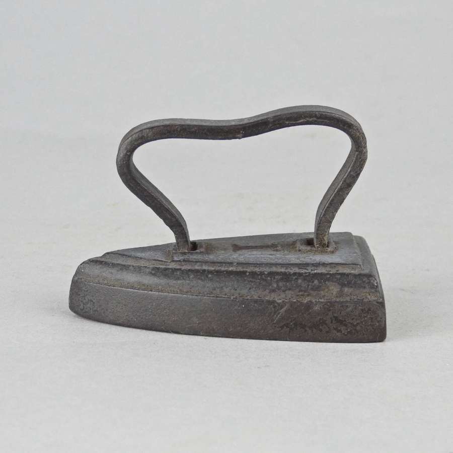 A miniature flat iron.