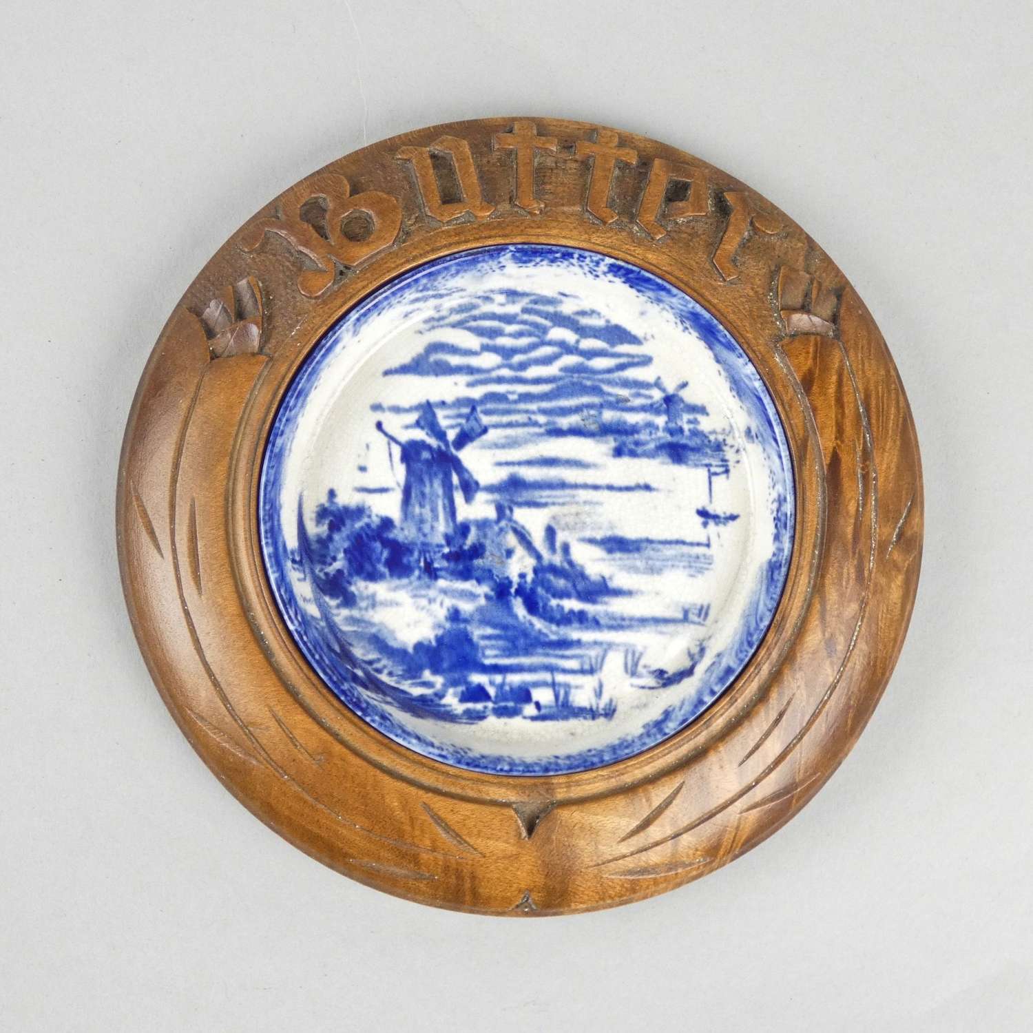 Blue printed butter dish with carved surround