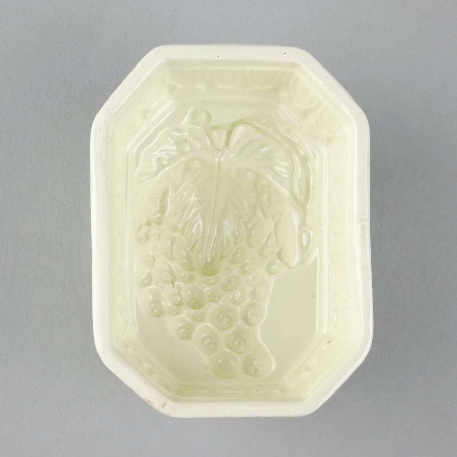 Creamware mould with grapes to base