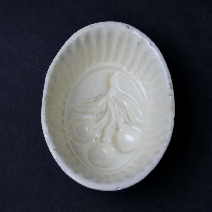 Creamware mould with cherries
