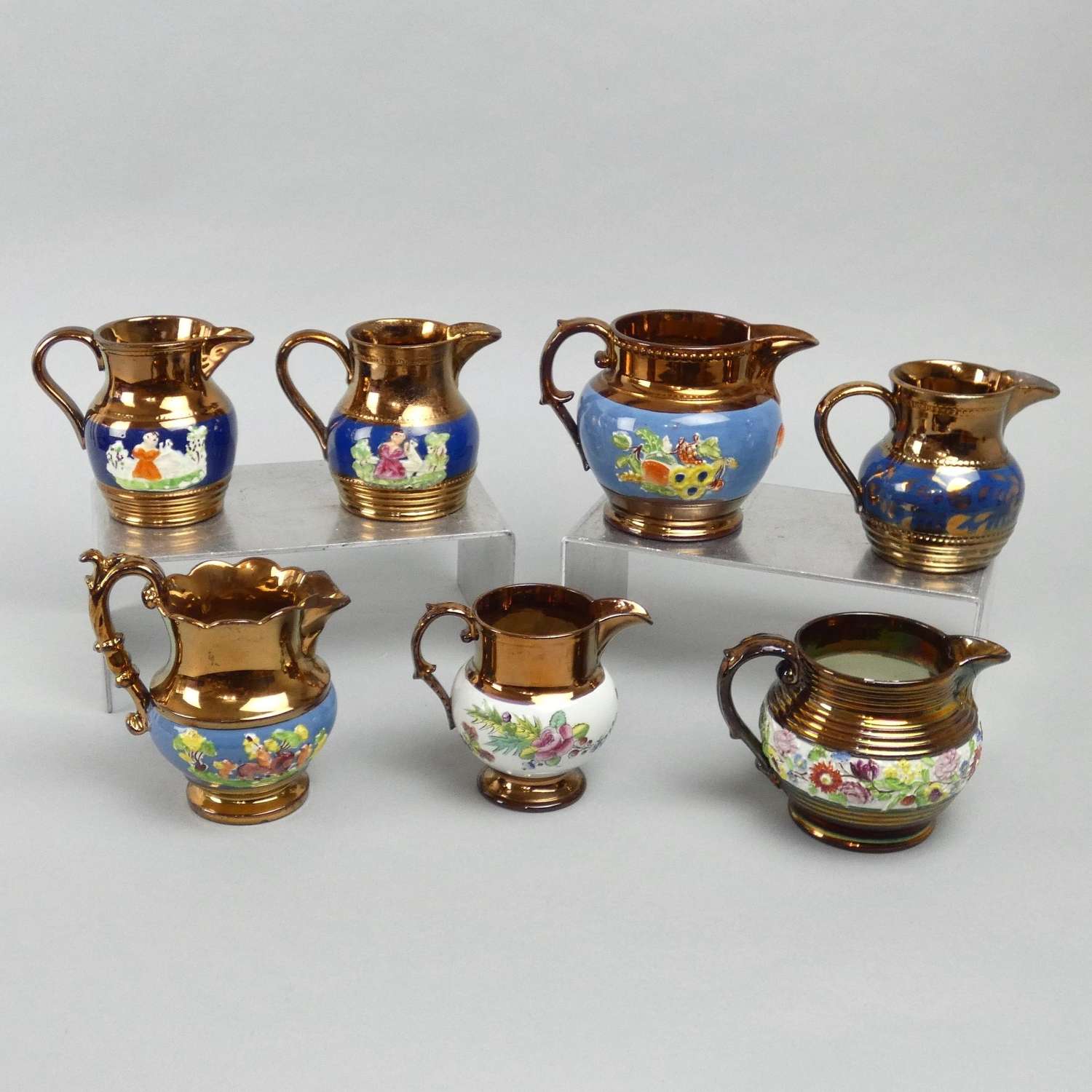 Collection of copper lustre jugs