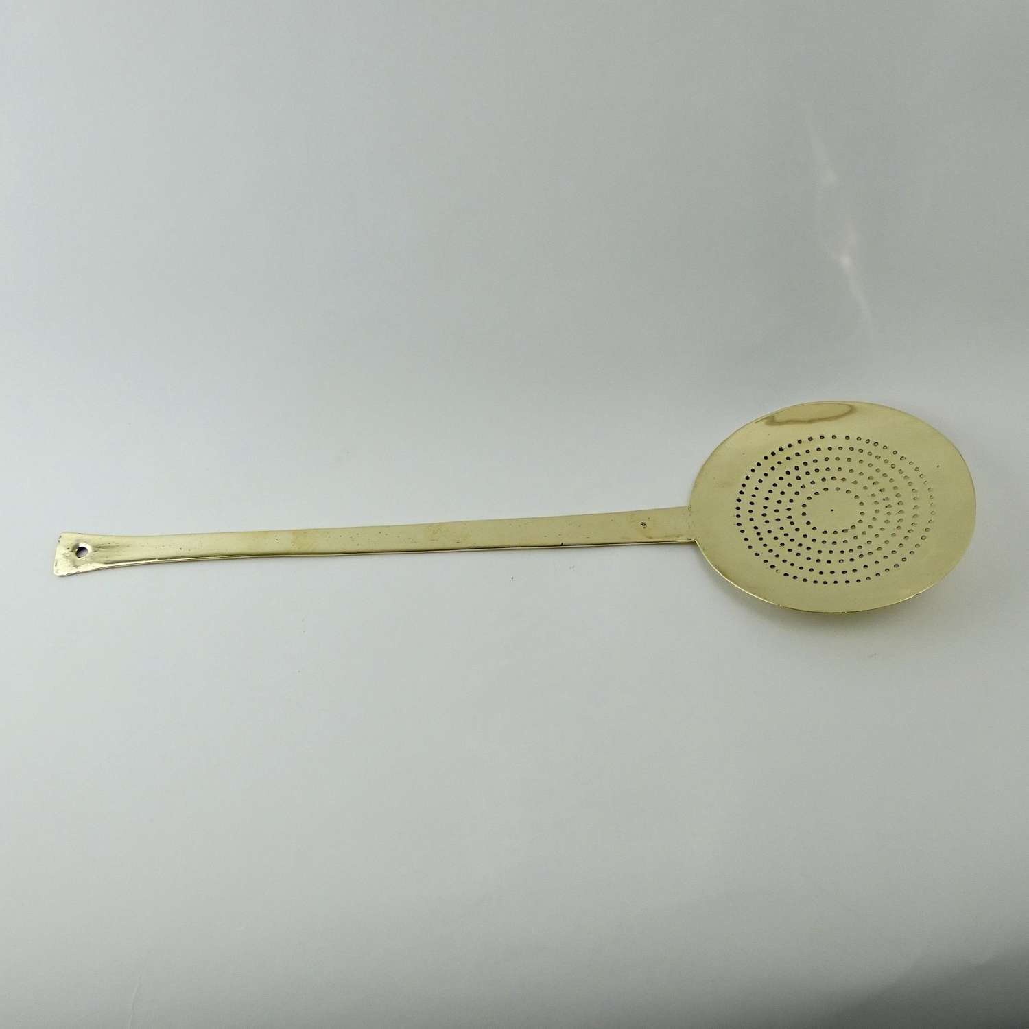 Cast brass skimmer with fishtail handle