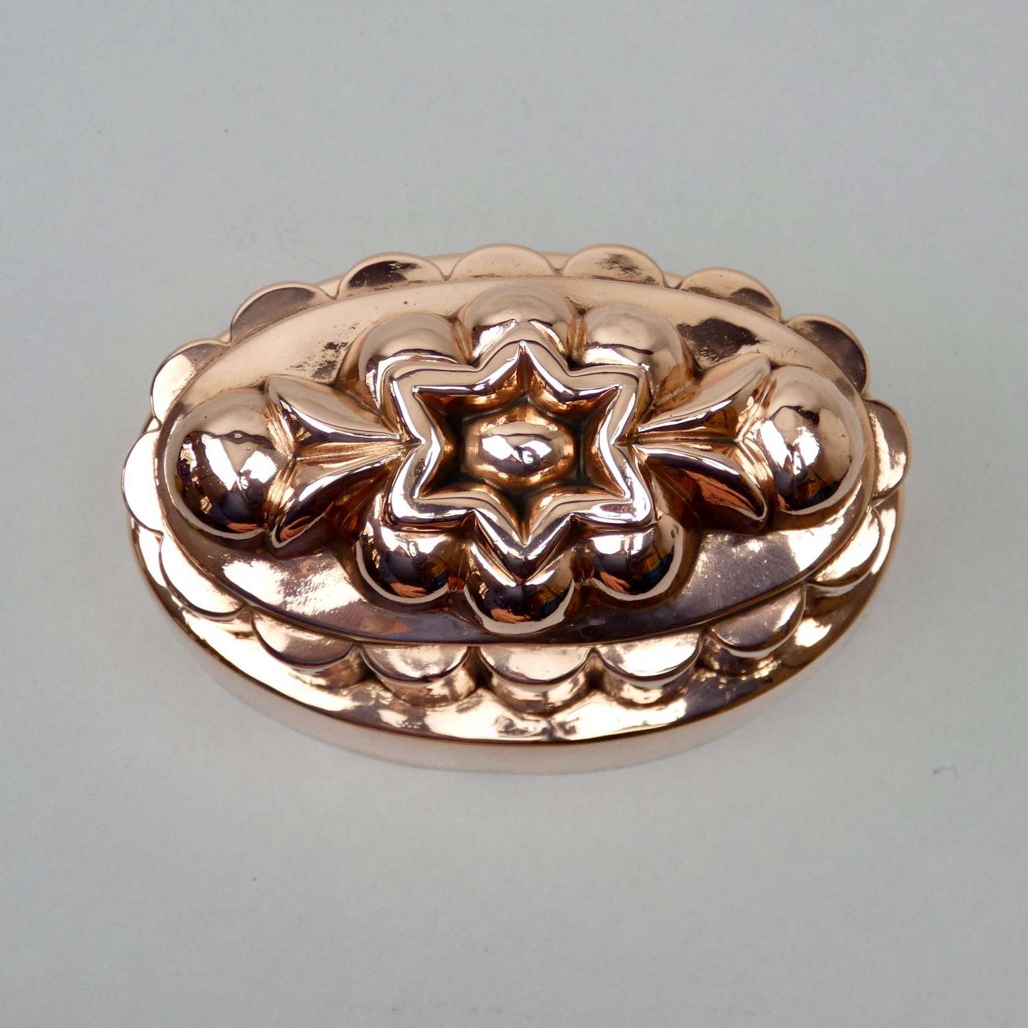Oval copper mould with central star