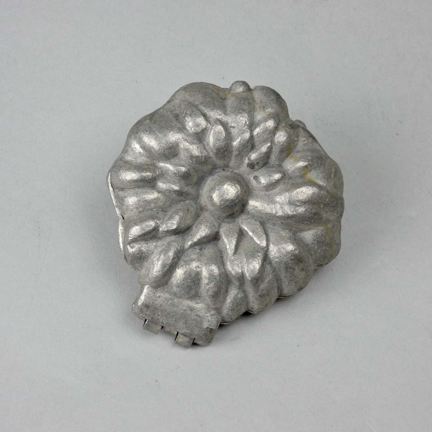 Pewter mould of a flower