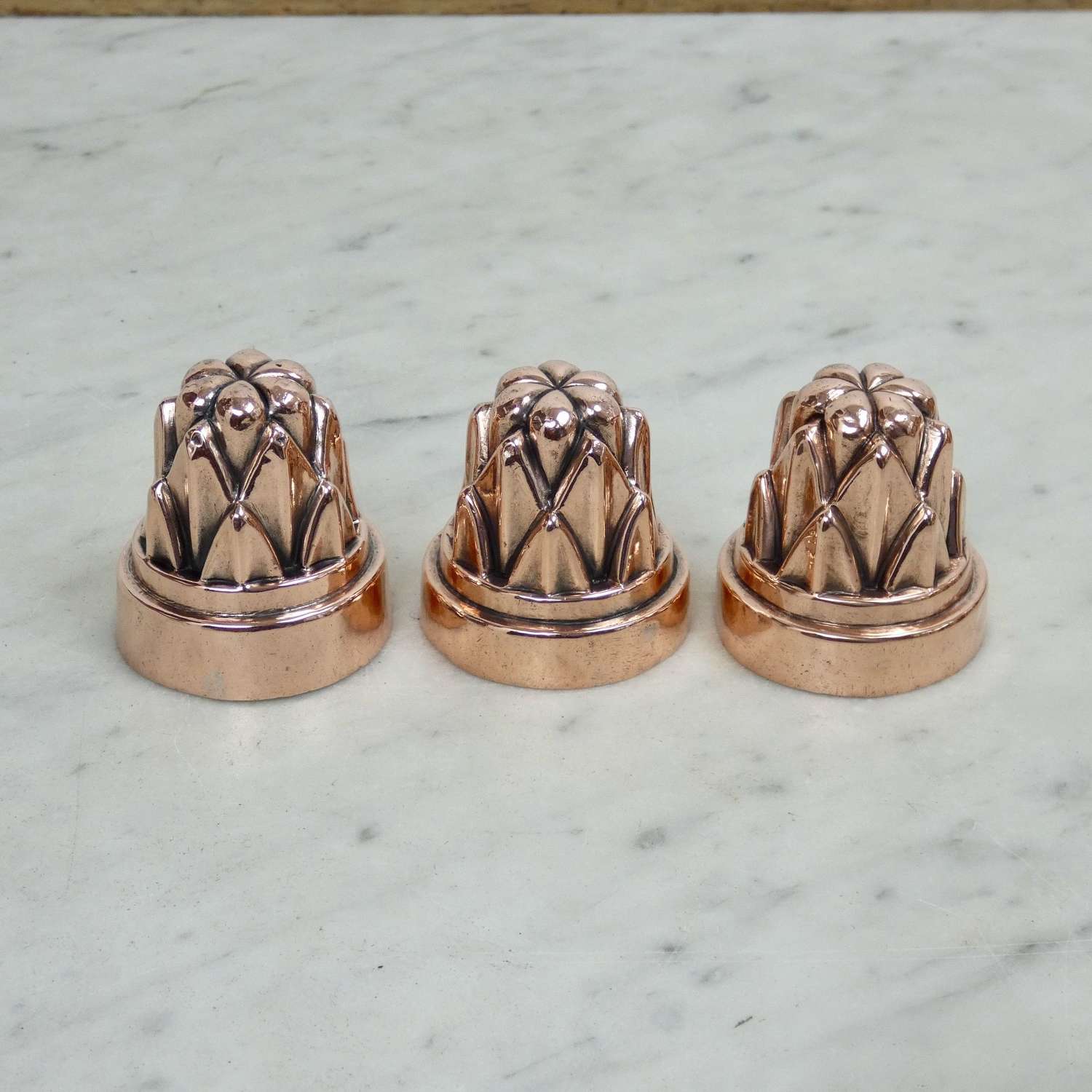 Miniature copper moulds of cardoons
