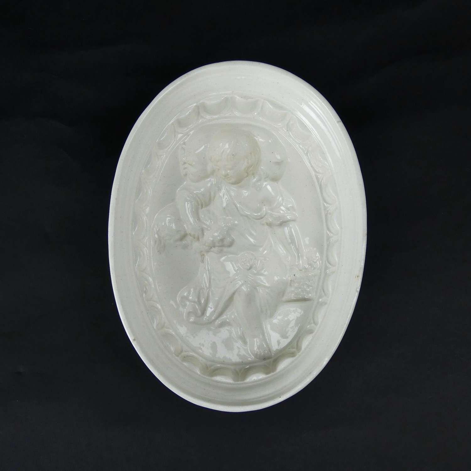 Creamware mould with child and dog
