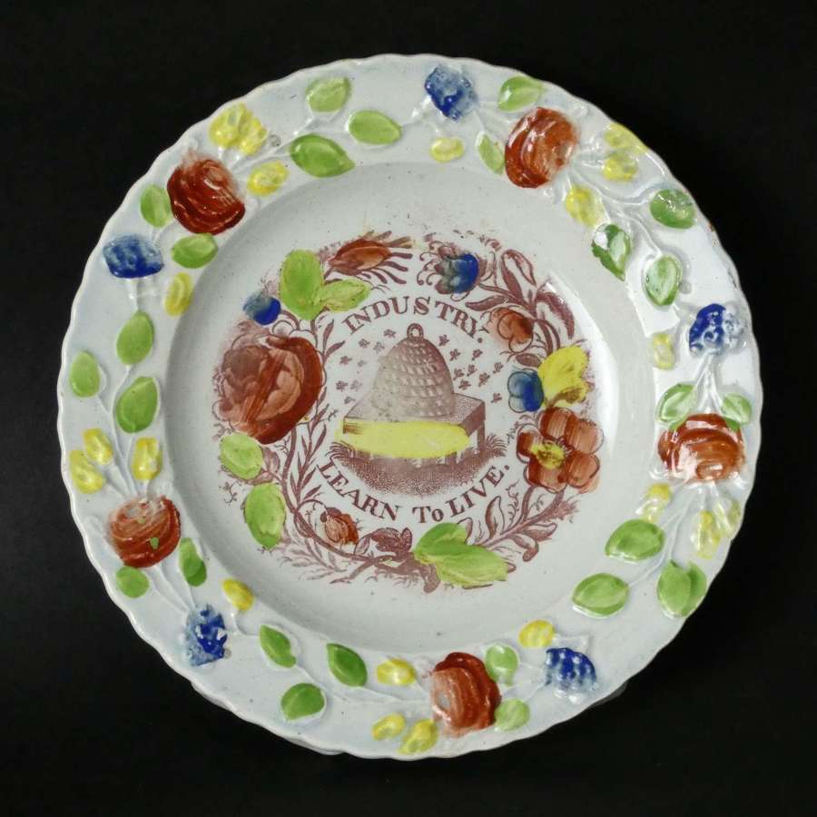 Child's plate printed with "Industry Learn to Live"
