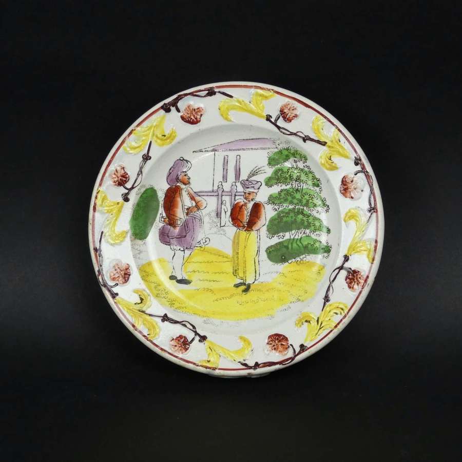 Child's plate with colourful, oriental gentlemen