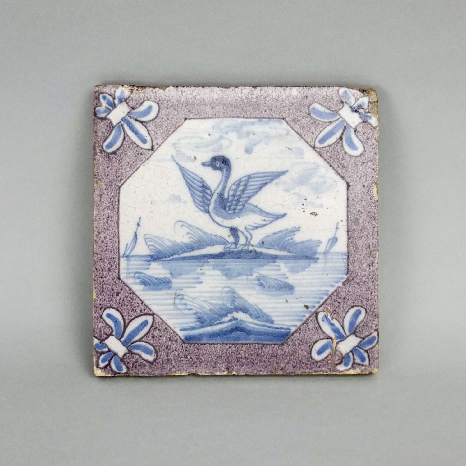 Delft tile painted with a swan