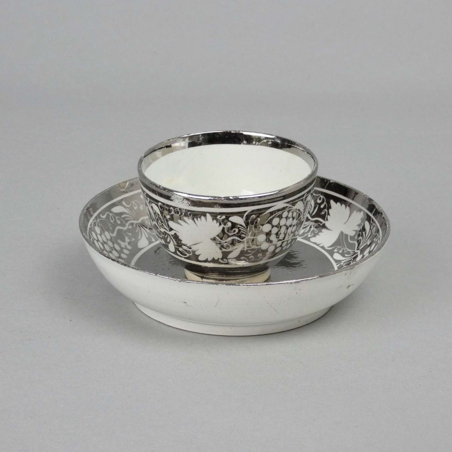 Silver lustre tea bowl & saucer