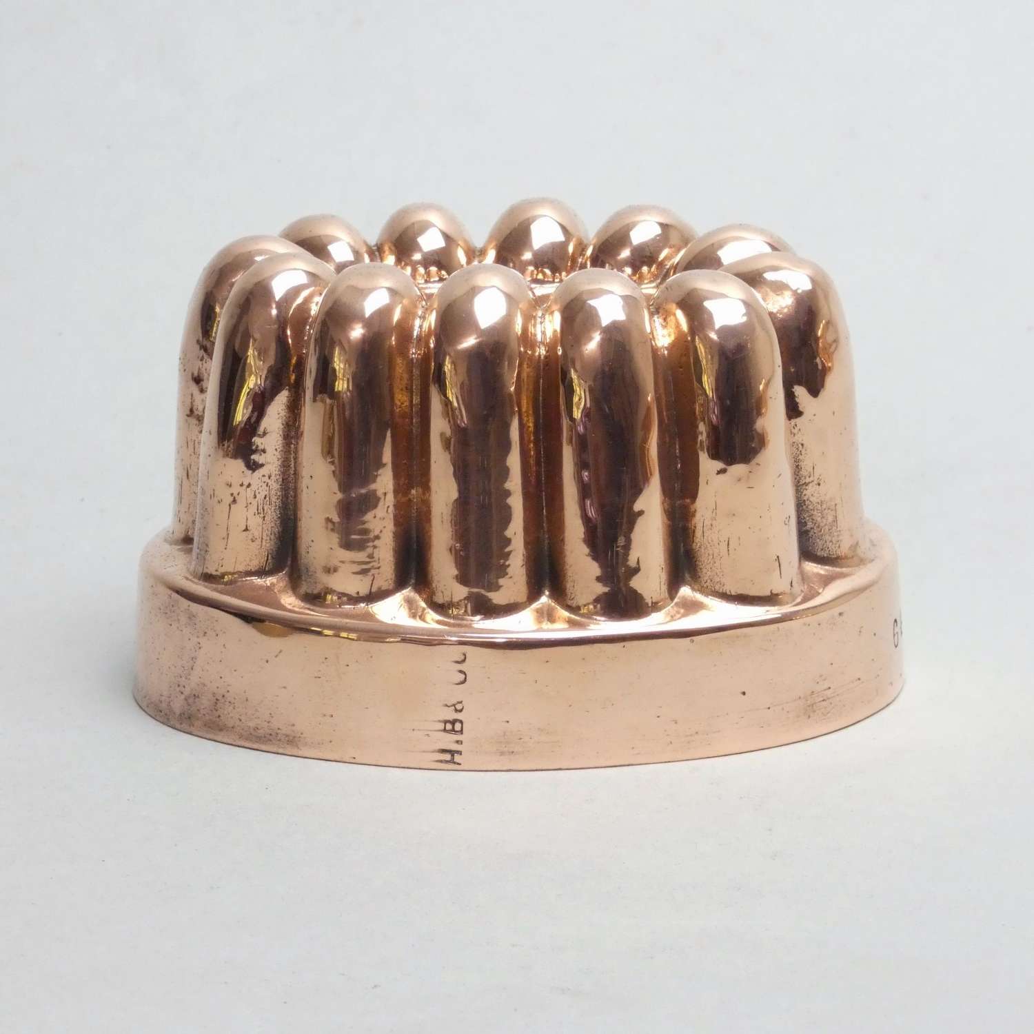 Small, fluted copper jelly mould