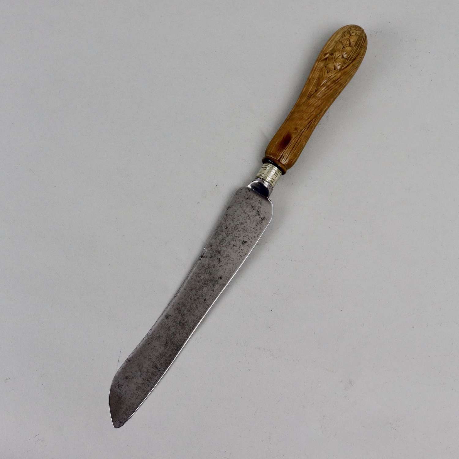 Bread knife with carved, sycamore handle