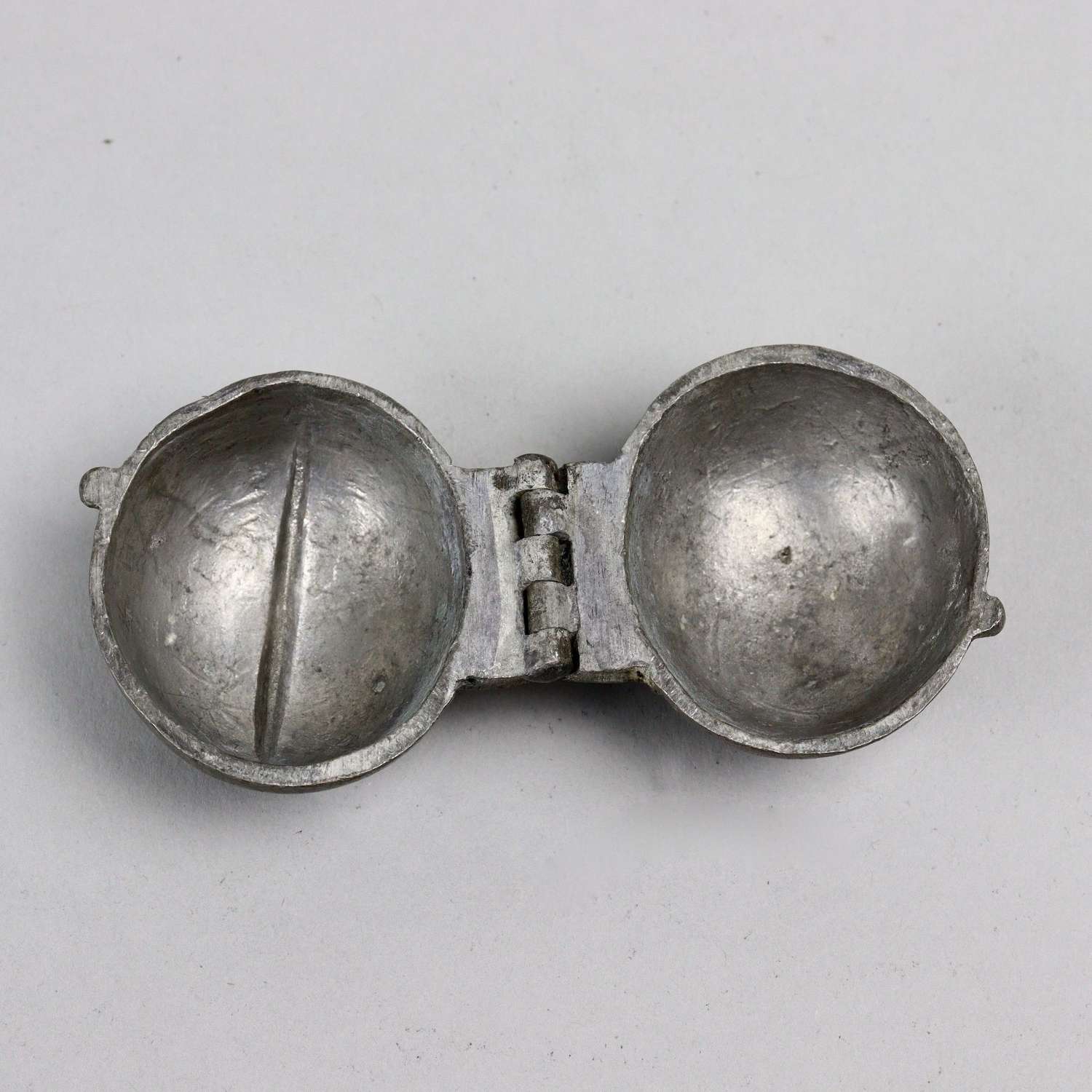 Pewter ice mould in the shape of a plum